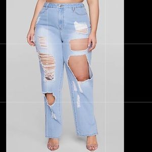Fashion to Figure Destructed light wash straight leg jeans.